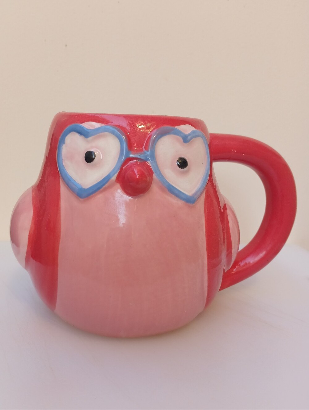 Adorable Spritz pink owl mug featuring heart-shaped glasses and a whimsical scul